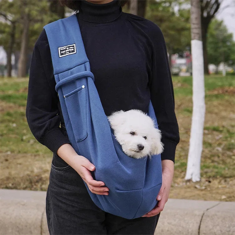 Pink pet sling carrier for small dogs and cats by FanzyMarket, crossbody design, portable travel bag, supports pets up to 7.5 kg.