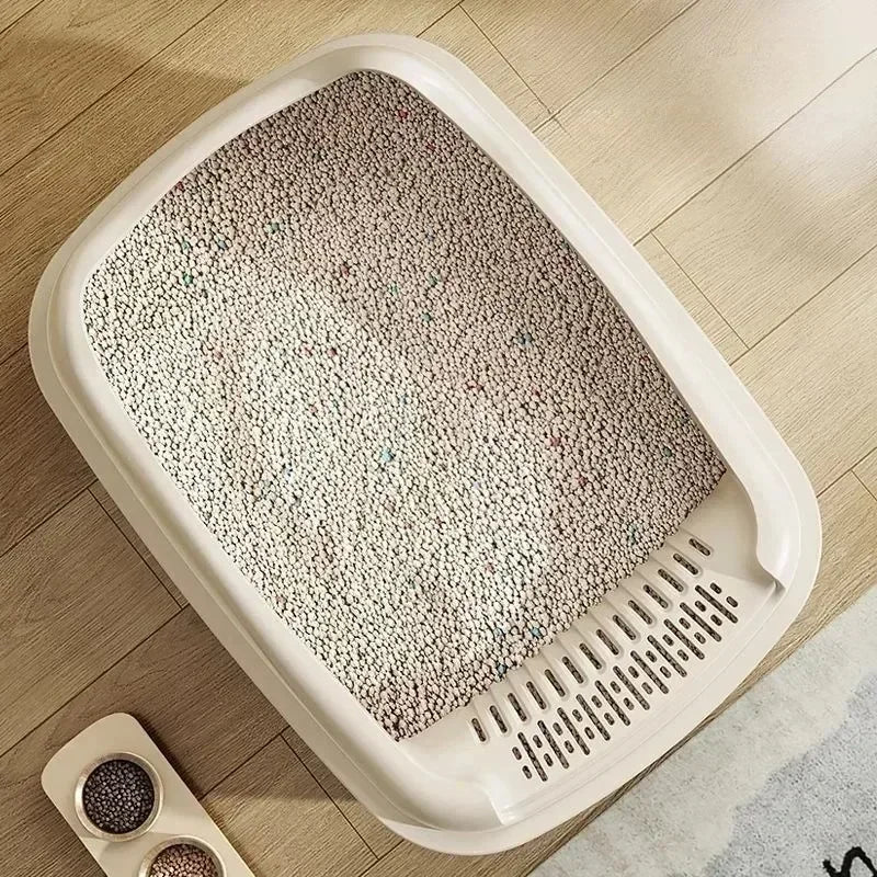 FanzyMarket high-sided green cat litter box with side entry, anti-splash design, suitable for pet grooming and hygiene.