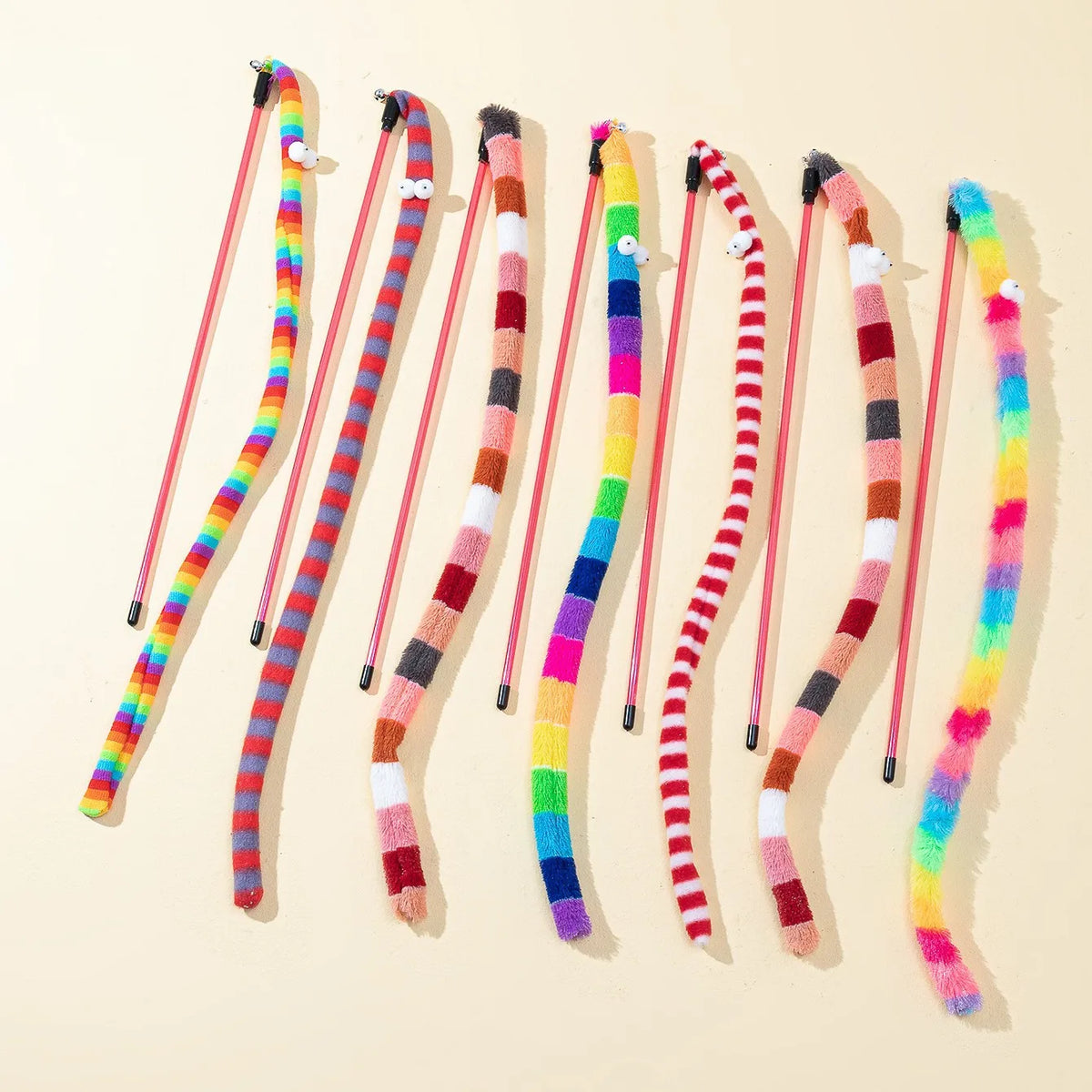 FanzyMarket interactive cat teaser wand with bell and plush gradient caterpillar tassel toy, designed to entertain cats.