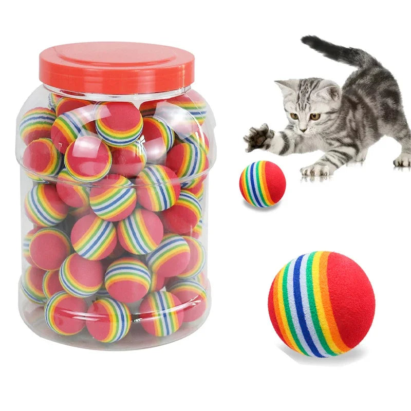 Ten rainbow-colored rubber pet balls for cats and dogs, featuring rattles for interactive play and training.