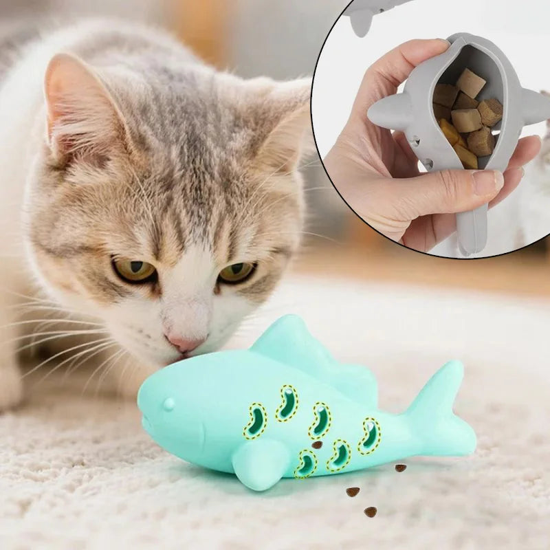 Gray fish-shaped silicone cat toy with treat dispenser, bite-resistant teeth-cleaning chew toy for kittens by FanzyMarket.