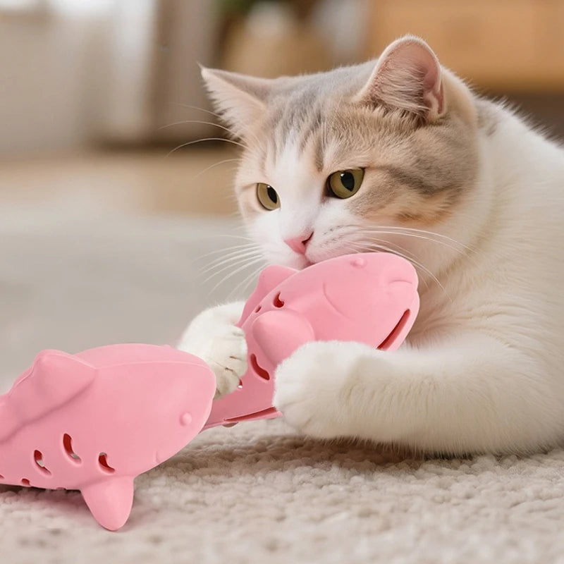 Gray fish-shaped silicone cat toy with treat dispenser, bite-resistant teeth cleaning chew toy for kittens by FanzyMarket.