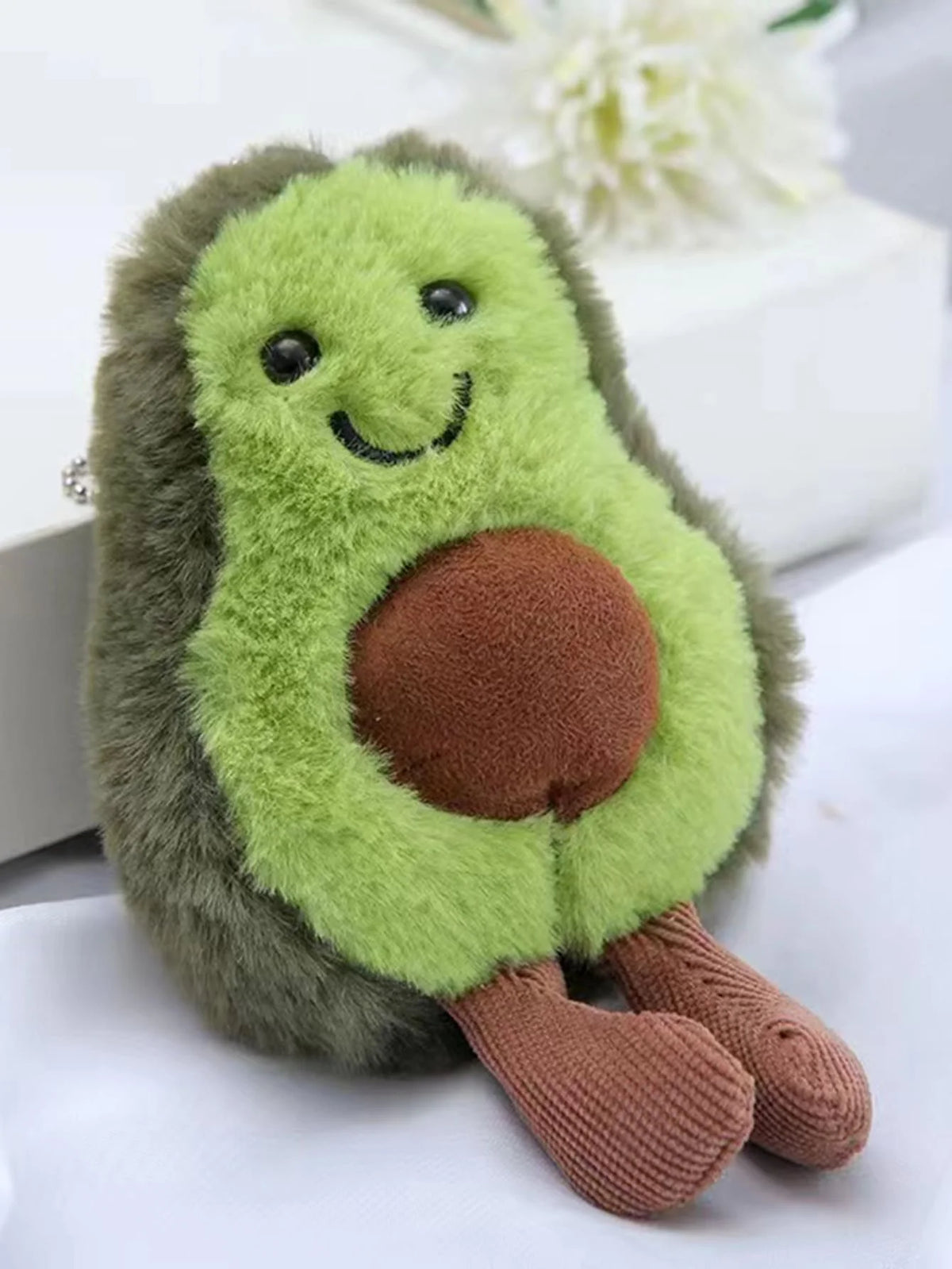 FanzyMarket avocado plush dog toy made of soft fleece, perfect for small and medium dogs to chew and cuddle.