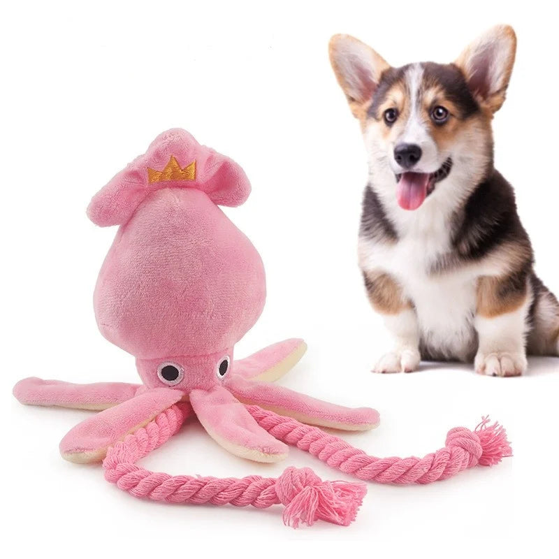 Pink plush octopus dog chew toy with squeaker and rope, small size, for dogs and cats, ideal for dental cleaning and play.