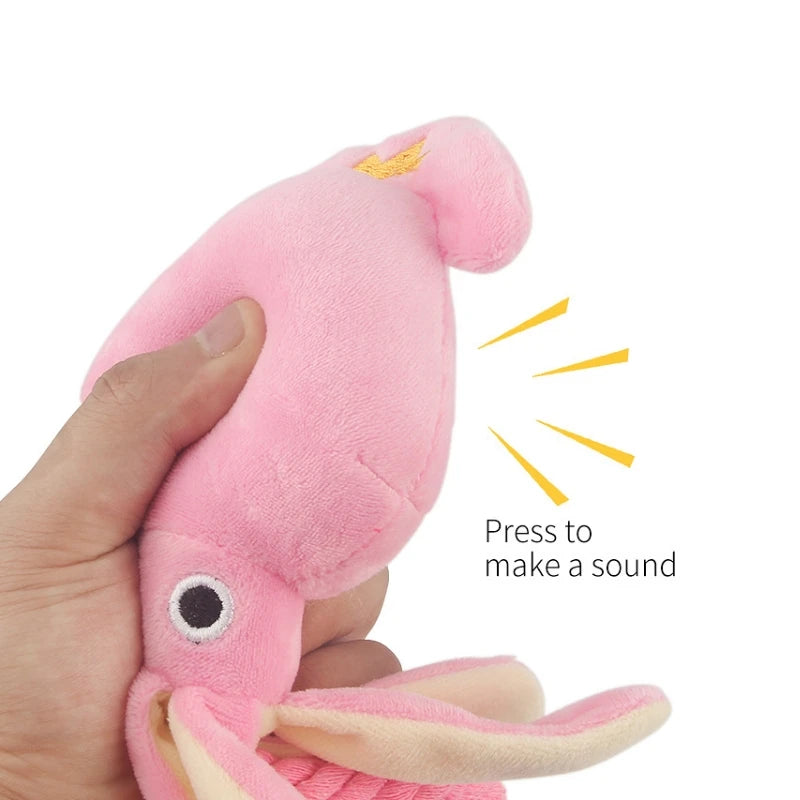 Pink octopus plush dog chew toy with squeaker and rope, small size, designed for dental cleaning for dogs and cats.