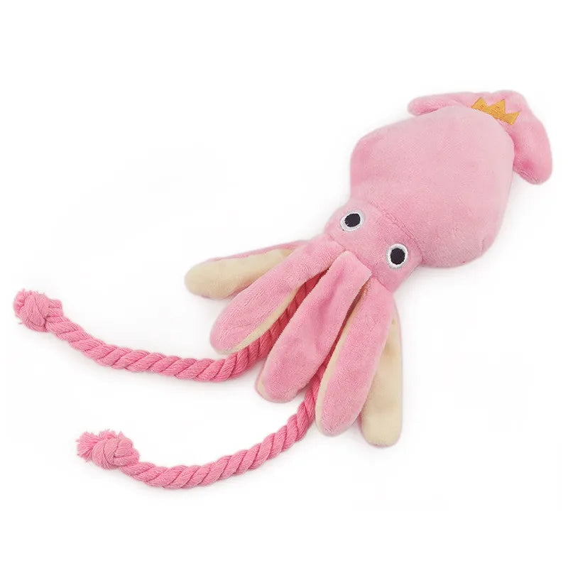 Pink plush octopus dog chew toy with squeaker and rope, small size, ideal for dental cleaning for dogs and cats.