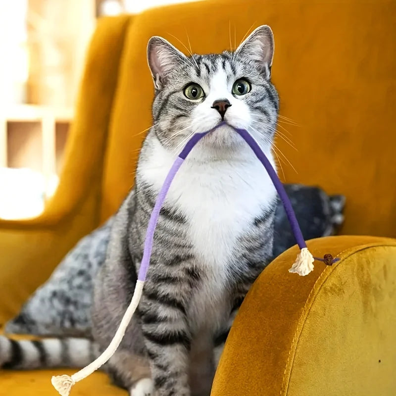 Purple FanzyMarket cat sisal rope chew toy for teeth grinding and interactive play, 7.87 inches long, durable pet toy for cats.