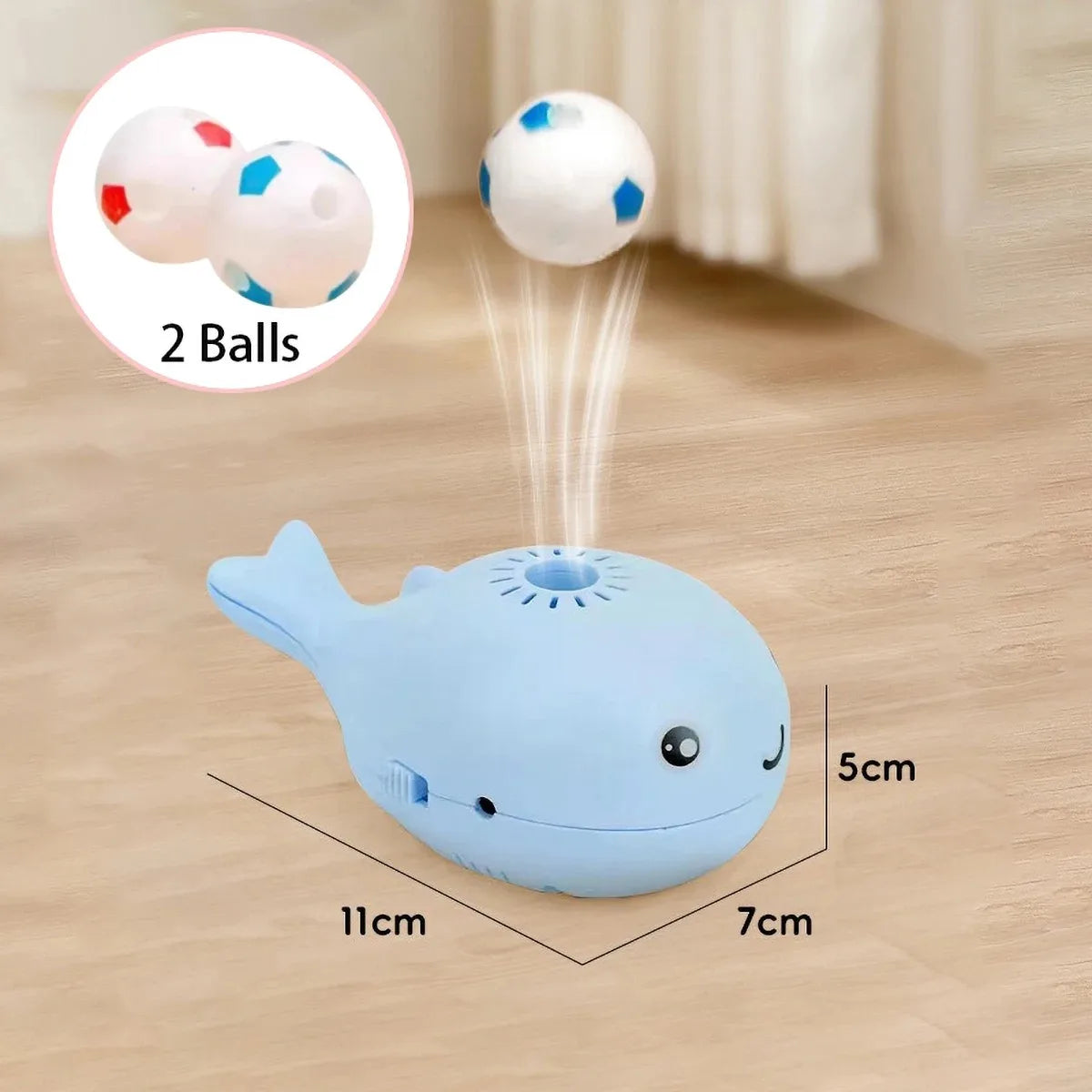Pink whale-shaped electric floating cat toy with USB rechargeable fan, portable and dual-function, from FanzyMarket pet supplies.