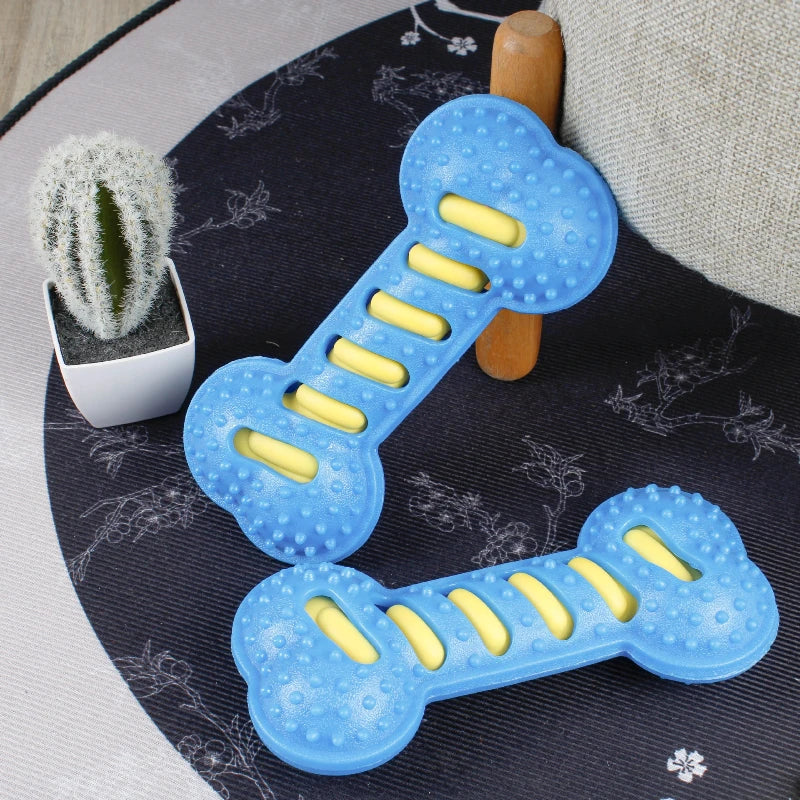 Yellow squeaky dog chew toy from FanzyMarket, bite-resistant puppy toothbrush for teeth cleaning and massage, 7.5 x 3.5 inches.