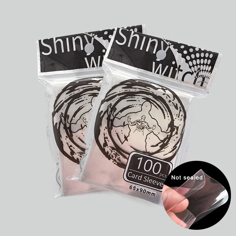 Set of 200 clear card sleeves for trading cards, perfect for Magic, Pokemon, Yu-Gi-Oh, and board games by FanzyMarket.
