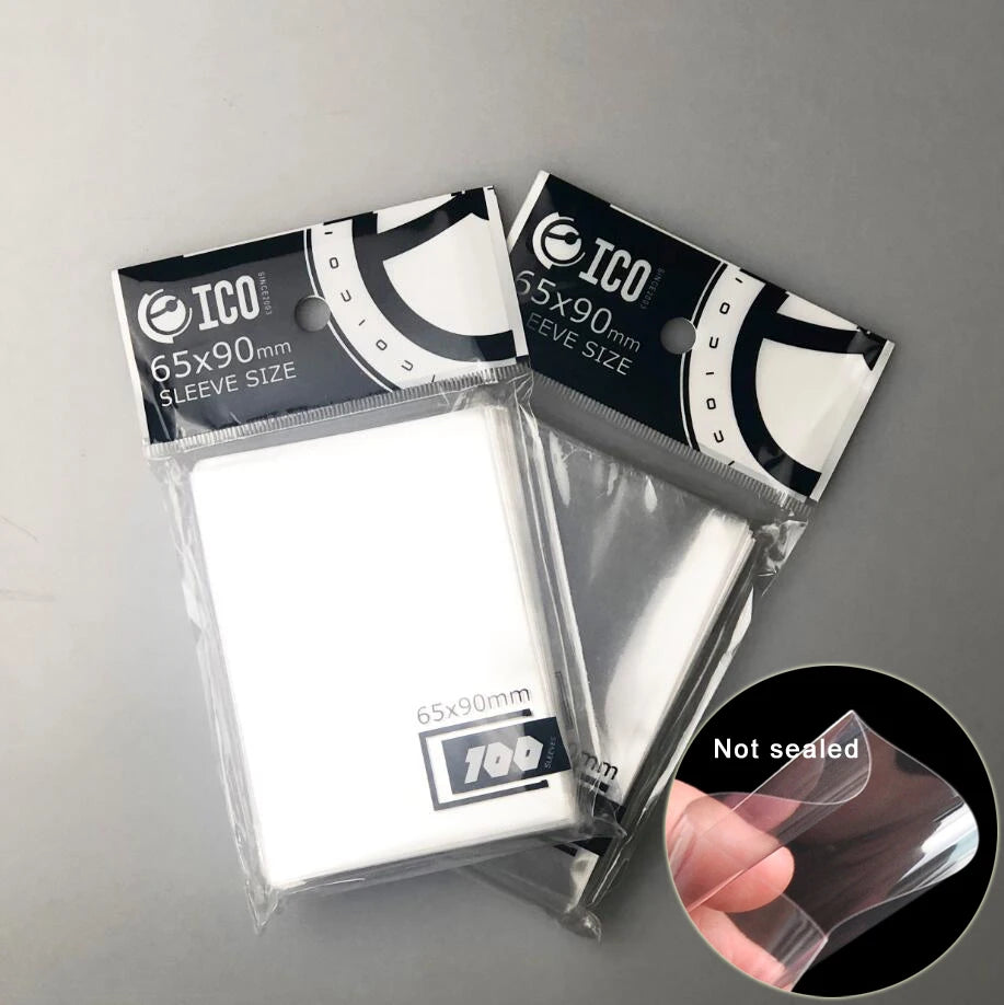 Set of 200 clear card sleeves for Magic, Pokemon, Yu-Gi-Oh, and board games, measuring 65 x 90 mm, by FanzyMarket.