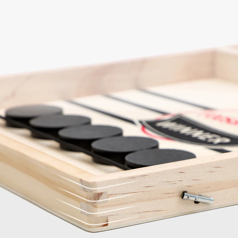 Wooden Sling Puck board game by FanzyMarket, a fast-paced 2-player tabletop game for family and kids, featuring black and natural wood pieces.