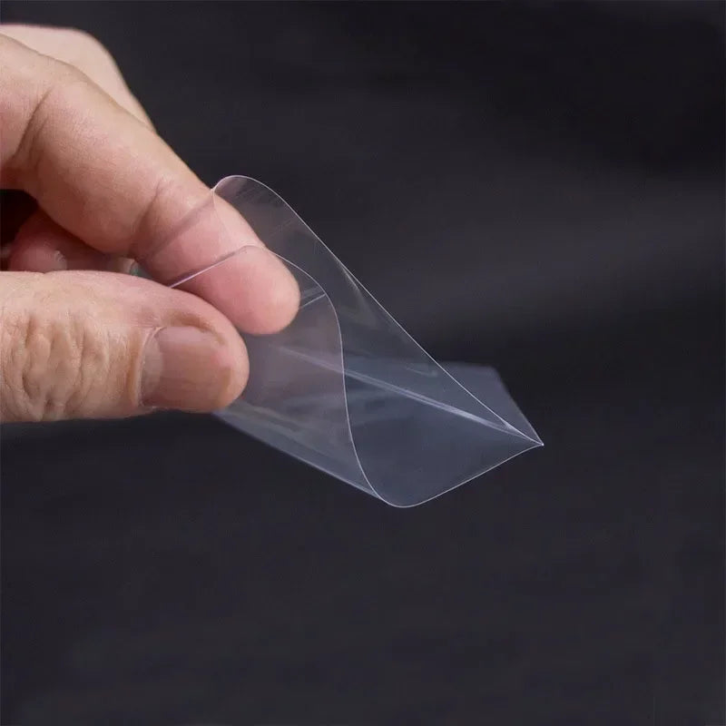 Set of 100 clear mixed-size card sleeves by FanzyMarket for trading cards, tarot, poker, and board games, shown in various sizes.