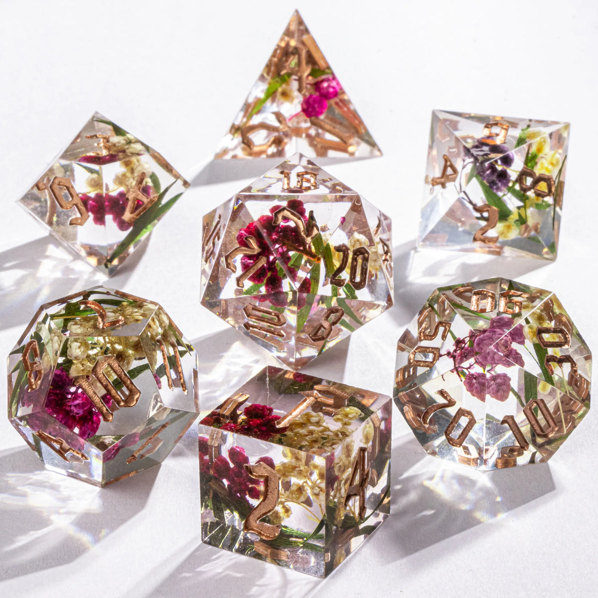 Handmade resin 7-piece D20 polyhedral dice set for Dungeons & Dragons and tabletop RPGs, featuring vibrant colors and detailed numbering.