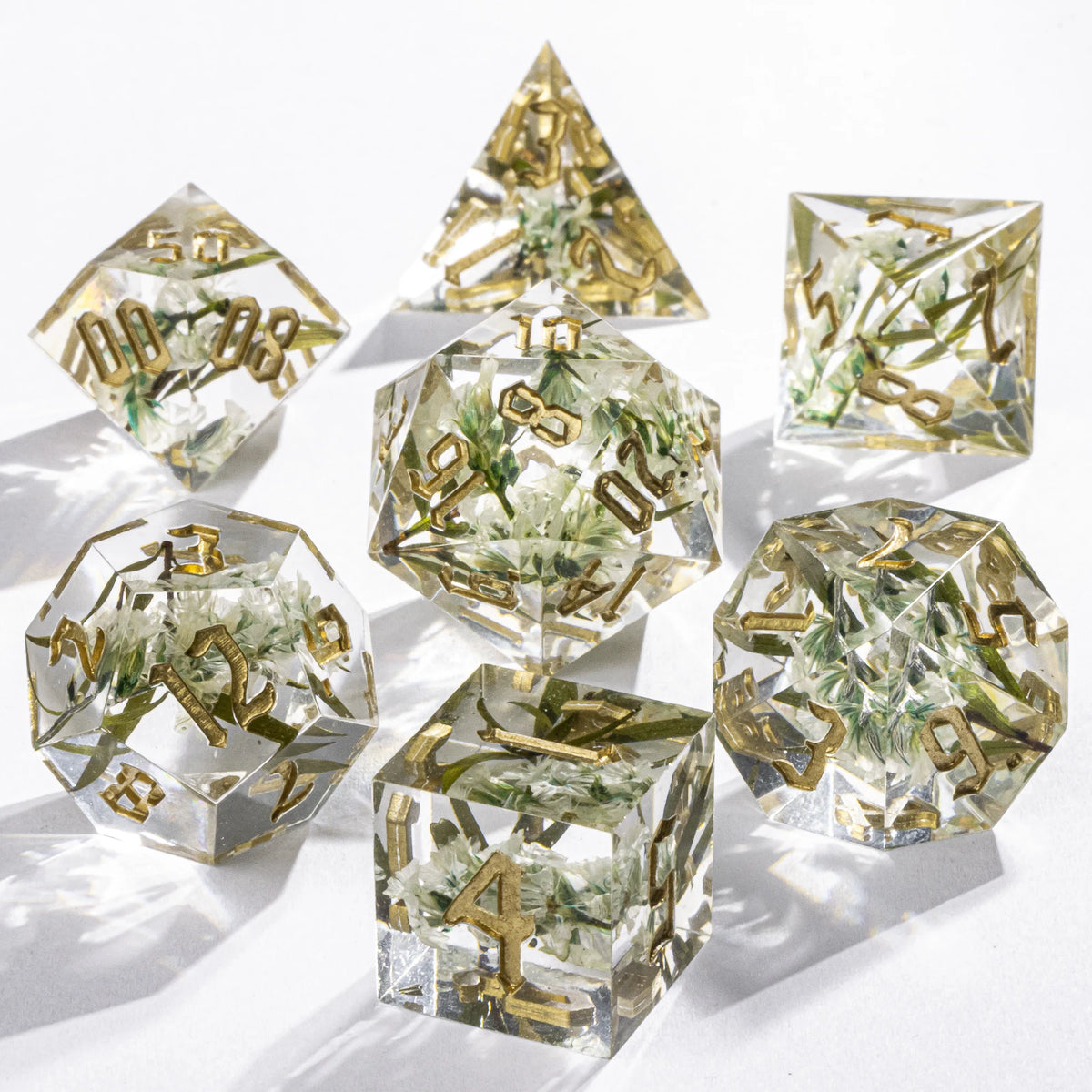 Handmade resin 7-piece D20 dice set for Dungeons & Dragons and tabletop RPGs, featuring colorful polyhedral dice by FanzyMarket.