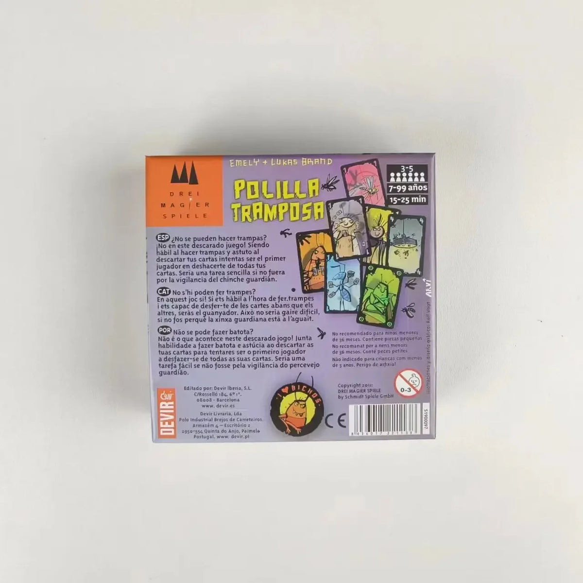 FanzyMarket Cheating Moth Spanish card game for family fun, featuring colorful cards and game components on a game table.