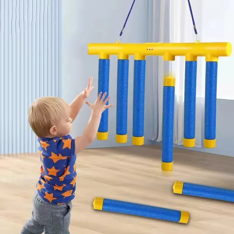 Light blue Falling Catching Sticks game by FanzyMarket, a sensory hand reaction toy for kids and adults, used for reflex training.