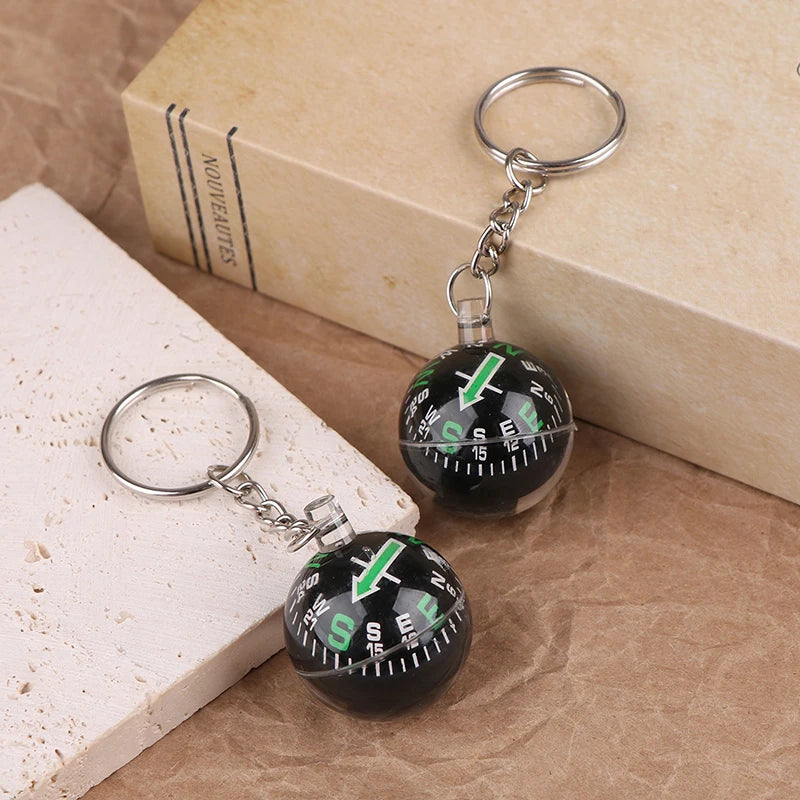 Mini compass keychain by FanzyMarket, 28mm outdoor survival pendant, perfect for camping, fishing, and outdoor adventures.
