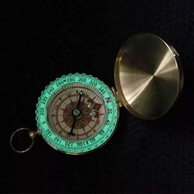Copper pocket compass by FanzyMarket, waterproof glow-in-the-dark navigation tool with lanyard, 2x2 inches for camping and outdoor use.