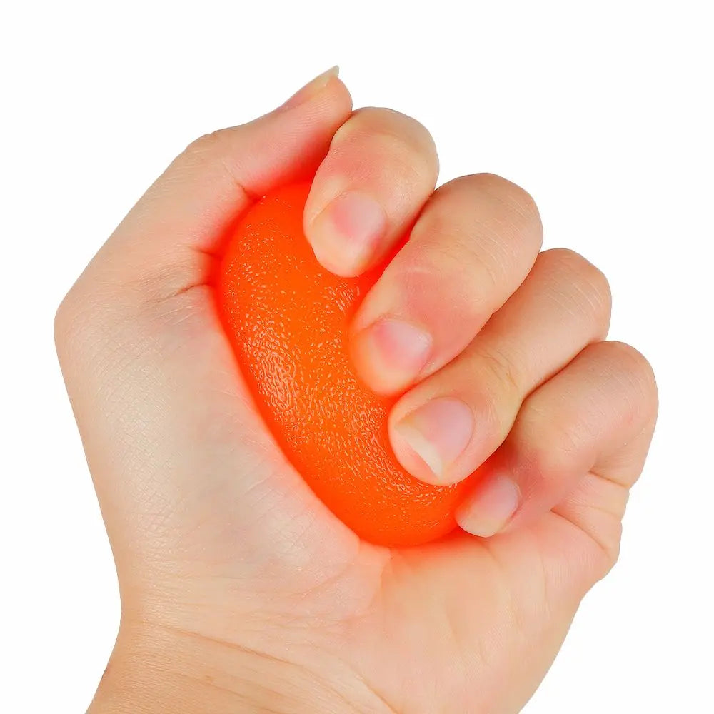 FanzyMarket silicone hand grip strength trainer ball in red, used for wrist rehab and stress relief, measuring 1.8 x 2.4 inches.