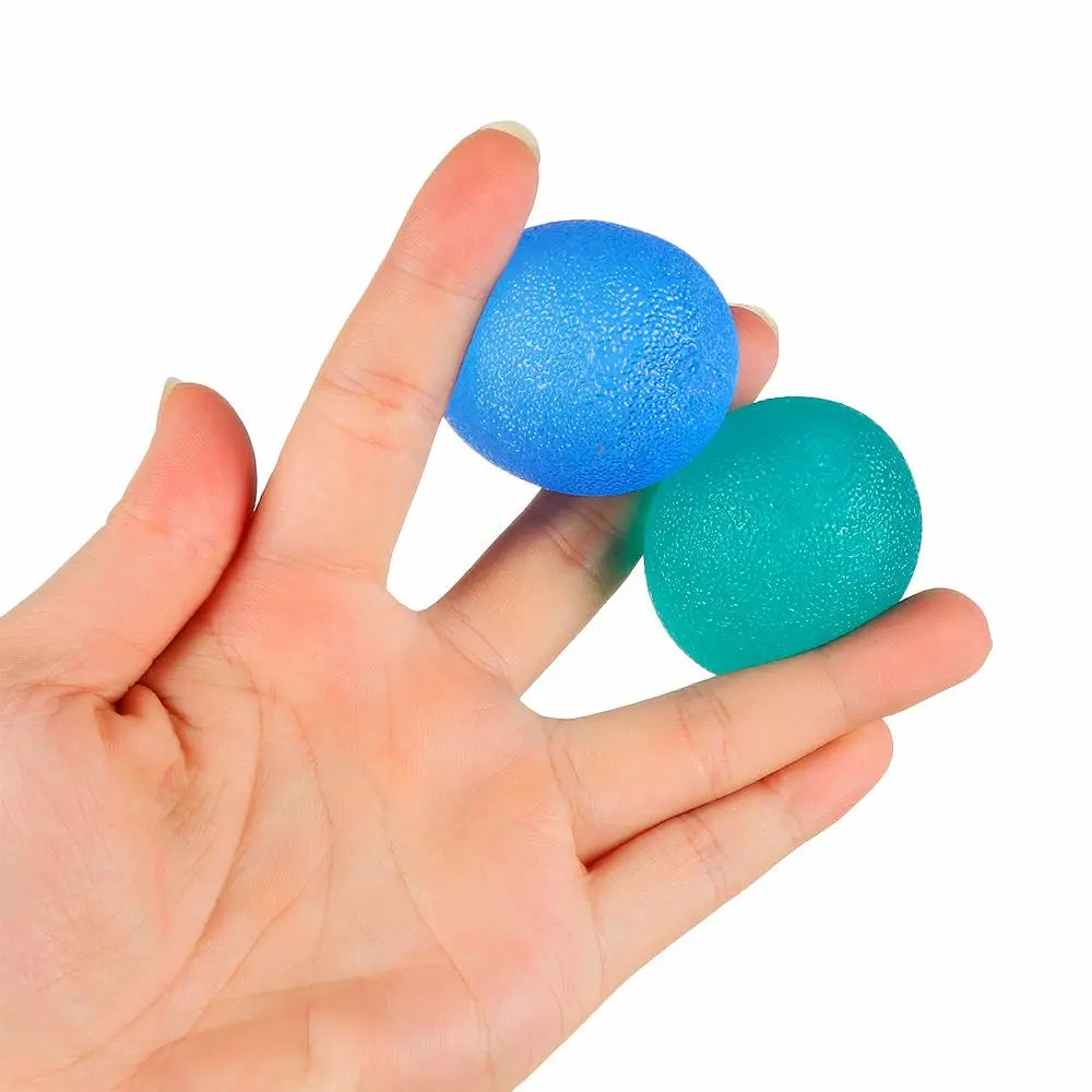 Red silicone hand grip strength trainer ball for wrist rehab and stress relief, measuring 1.8 x 2.4 inches, by FanzyMarket.